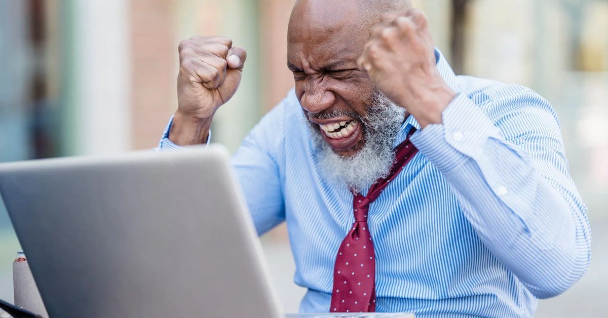 Business owner checking website on laptop